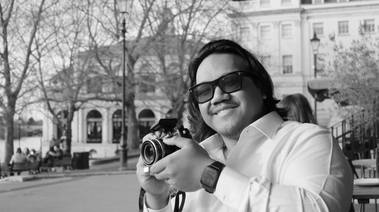 Braeden Bihag holding a Fujifilm camera